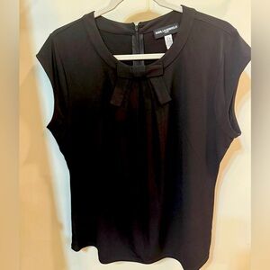 Dressy black blouse with front bow.